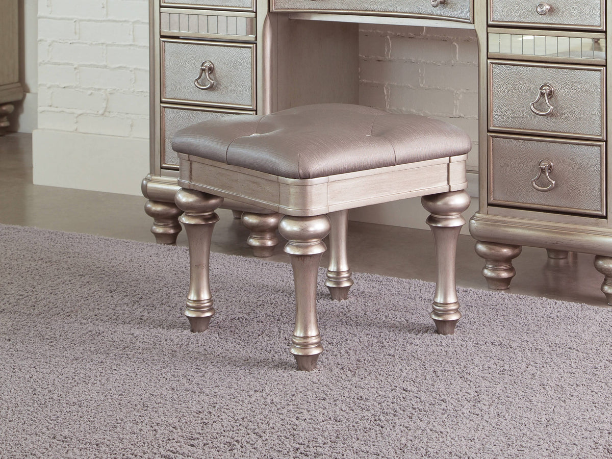Upholstered Vanity Stool Metallic Platinum Its metallic finish and highlight glaze create a glamorous effect. - 204189 coastmega