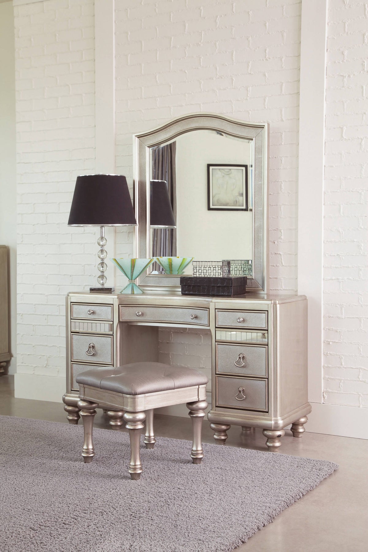 Upholstered Vanity Stool Metallic Platinum Its metallic finish and highlight glaze create a glamorous effect. - 204189 coastmega