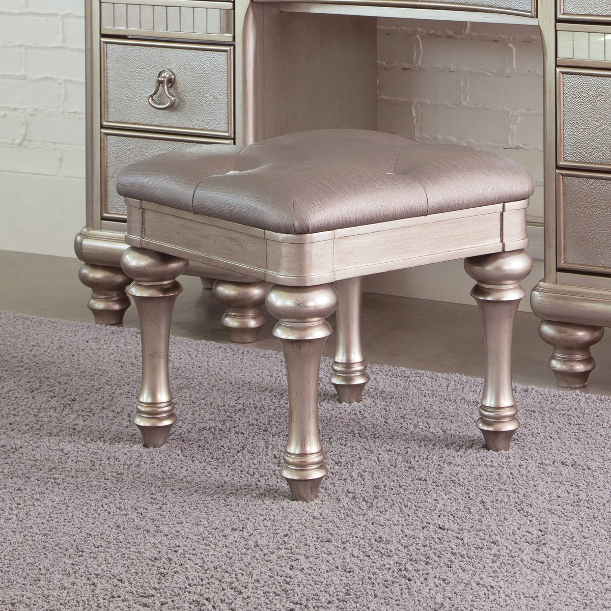Upholstered Vanity Stool Metallic Platinum Its metallic finish and highlight glaze create a glamorous effect. - 204189 coastmega